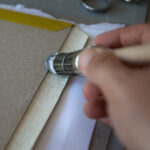 Gluing edges during bookbinding