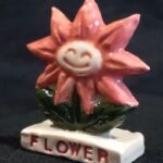 Flower on a plinth