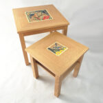 Bespoke nest of Oak tables with hand cut marquetry.